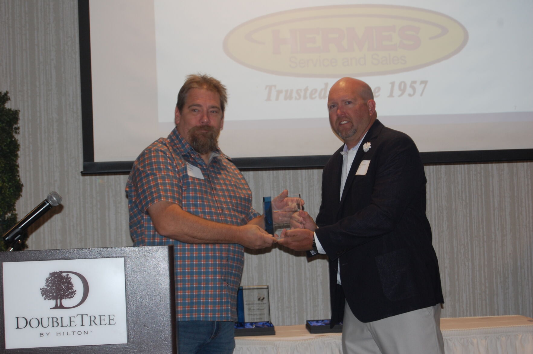 Stuart Nerby receiving the Small Business Partner Award for Hermes Service & Sales